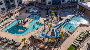 Pool featuring fence and a patio area