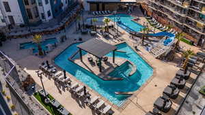 Community pool featuring a water slide