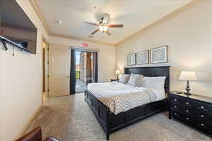 Bedroom featuring light carpet, a textured ceiling, access to exterior, visible vents, and crown molding