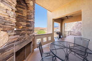 Balcony featuring grilling area, a ceiling fan, and outdoor dining space
