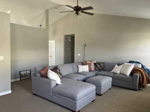 Living area featuring high vaulted ceiling, ceiling fan.