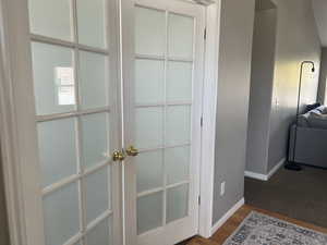 Entry with french doors going into office/den.