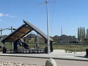 Surrounding community with a lawn, a playground,
