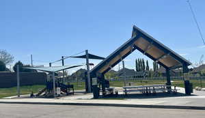 View of property's community featuring playground community.