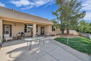 View of patio featuring fence