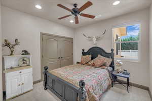 Bedroom featuring recessed lighting, visible vents, a ceiling fan, a closet, and baseboards