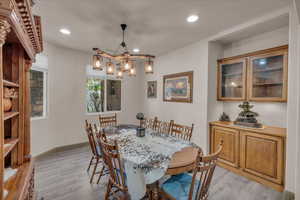 Dining room featuring recessed lighting, light wood-style flooring, and baseboards