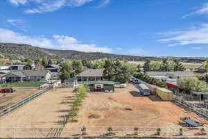 Birds eye view of property with a rural view, a residential view, and a mountain view