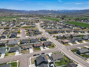 Birds eye view of property with a residential view and a mountain view