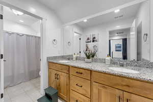 Upstairs full bathroom with dual vanity sinks