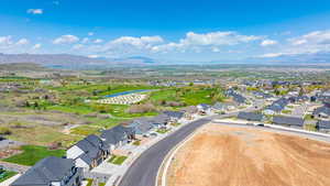 Drone / aerial view featuring a residential view and a water and mountain view