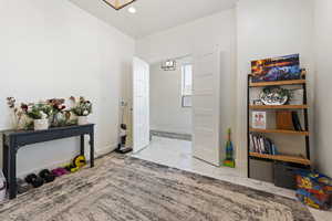Foyer with recessed lighting, marble finish floor, baseboards, and an inviting chandelier