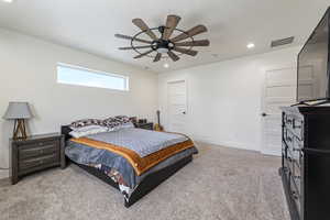 Bedroom featuring recessed lighting, visible vents, a ceiling fan, light carpet, and baseboards