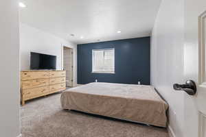 Carpeted bedroom featuring recessed lighting