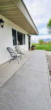View of patio / terrace with a mountain view. Front door