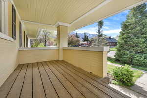 Wooden terrace featuring a mountain view