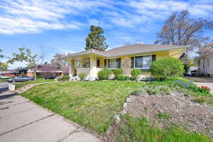 View of front of house with a front yard