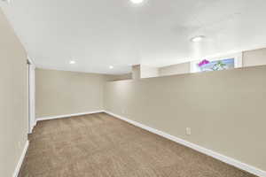 Basement with recessed lighting, carpet floors, and baseboards