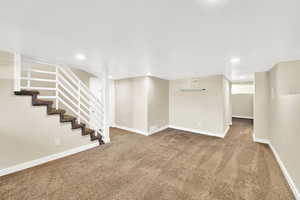 Finished basement with recessed lighting, carpet, visible vents, and baseboards