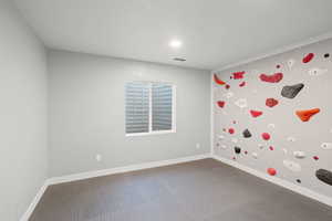 Empty room with baseboards and visible vents