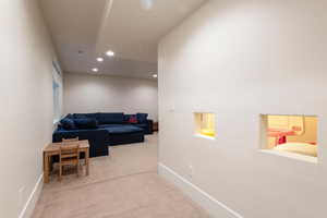 Entry into basement with kids play area under stairs
