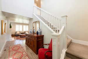Nice wide entryway with beautiful staircase