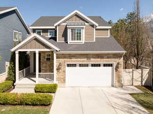 Front of home with stone, cement board and lovely deck