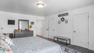 Bedroom featuring visible vents and carpet floors