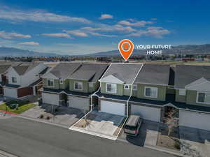 Drone / aerial view featuring a residential view and a mountain view