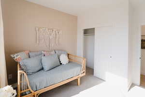 Model Home PicsCarpeted bedroom with baseboards and a closet
