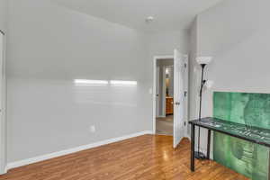Empty room featuring wood finished floors and baseboards