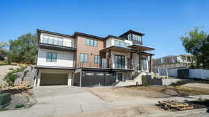 Contemporary home with multiple balconies and panoramic views of the Salt Lake Valley