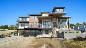 Contemporary home with multiple balconies and panoramic views of the Salt Lake Valley