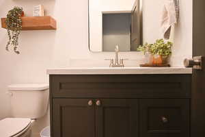 Bathroom with toilet and vanity