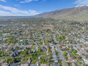 Birds eye view of property with a mountain view and a residential view
