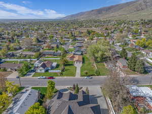 Birds eye view of property featuring a mountain view and a residential view