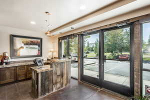 Entryway with concrete floors, a healthy amount of sunlight, and recessed lighting