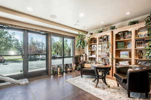 Living area with recessed lighting and concrete floors