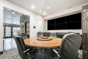 Tiled dining space featuring visible vents and recessed lighting