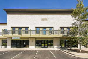 View of property with uncovered parking