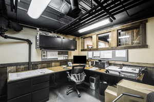 Office area featuring built in desk