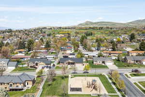 Birds eye view of property featuring a mountain view and a residential view