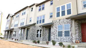 Exterior space with stone siding and stucco siding