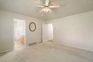 Primary bedroom with ensuite bath and large walk in closet
