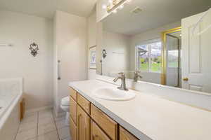 Primary bath, with large tub and separate shower