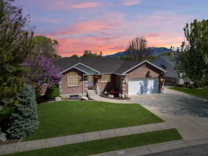 Ranch-style home featuring mountain view, beautiful yard and 2 car garage
