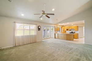 Open Living, dining and kitchen area with beautiful natural lighting