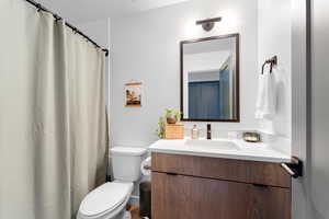 Full bath featuring vanity and a shower with curtain