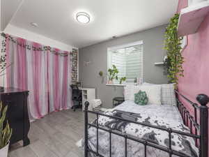 Bedroom featuring visible vents and light wood-style flooring