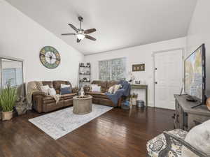 Living room with vaulted ceiling, wood finished floors, and ceiling fan